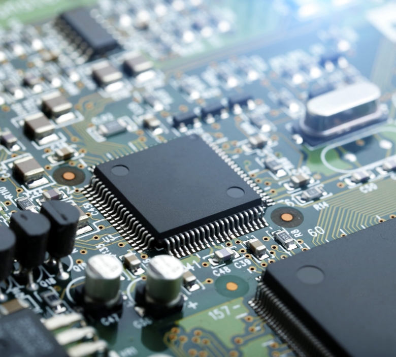 Closeup of electronic circuit board with CPU microchip electronic components background